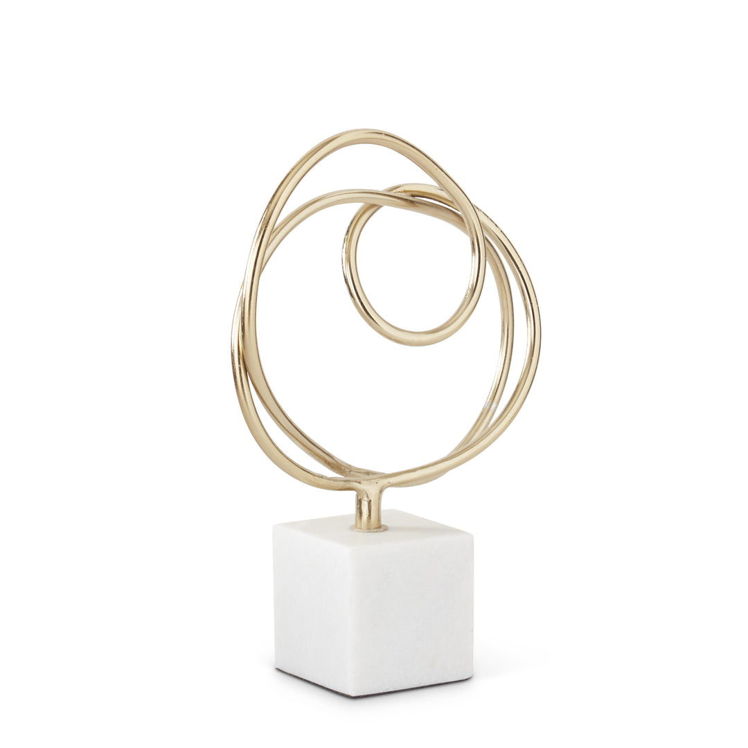 Gold Sculpture on White Marble Base