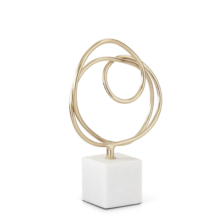 Gold Sculpture on White Marble Base